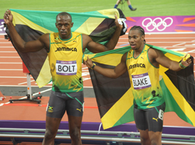 Bolt and Blake with Jamaican flags