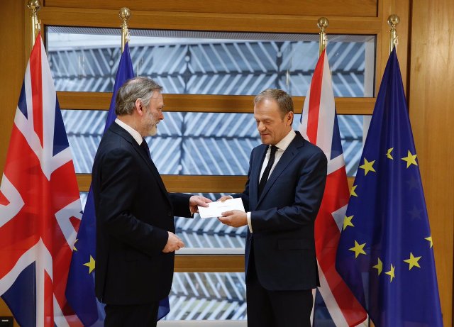 Britain's EU Ambassador Sir Time Barrow hands letter to Donald Tusk