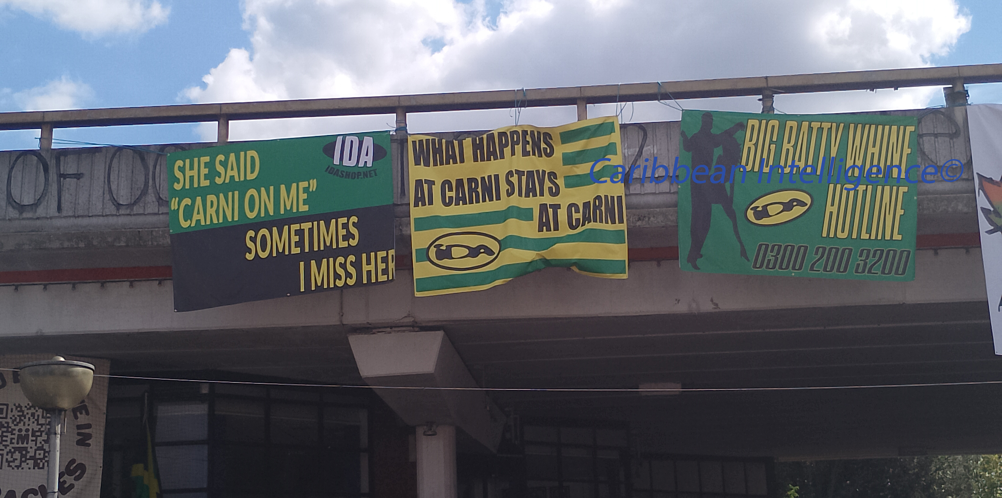 posters on the Westway at Notting Hill Carnival