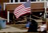 US flag outside damaged NY home