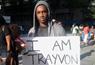Man holding placard saying 'I am Trayvon'